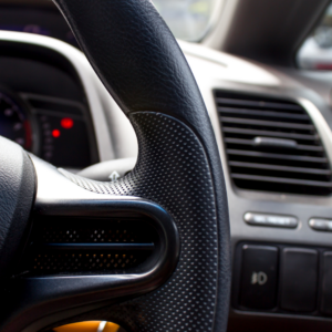 View of a steering wheel from the driver's side.
