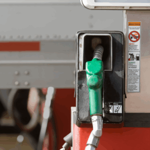 A diesel gas pump beside a truck heading in for diesel maintenance.