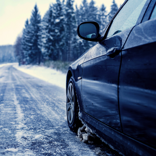 A car navigates an icy road.