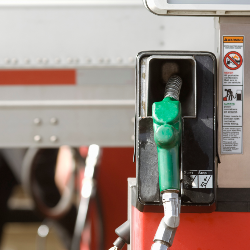 A diesel fuel nozzle mounted to a fuel station.